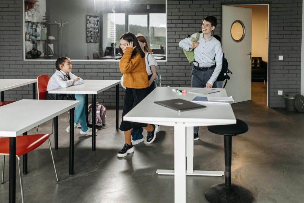 Students engage in a lively classroom environment, fostering a diverse and inclusive atmosphere.